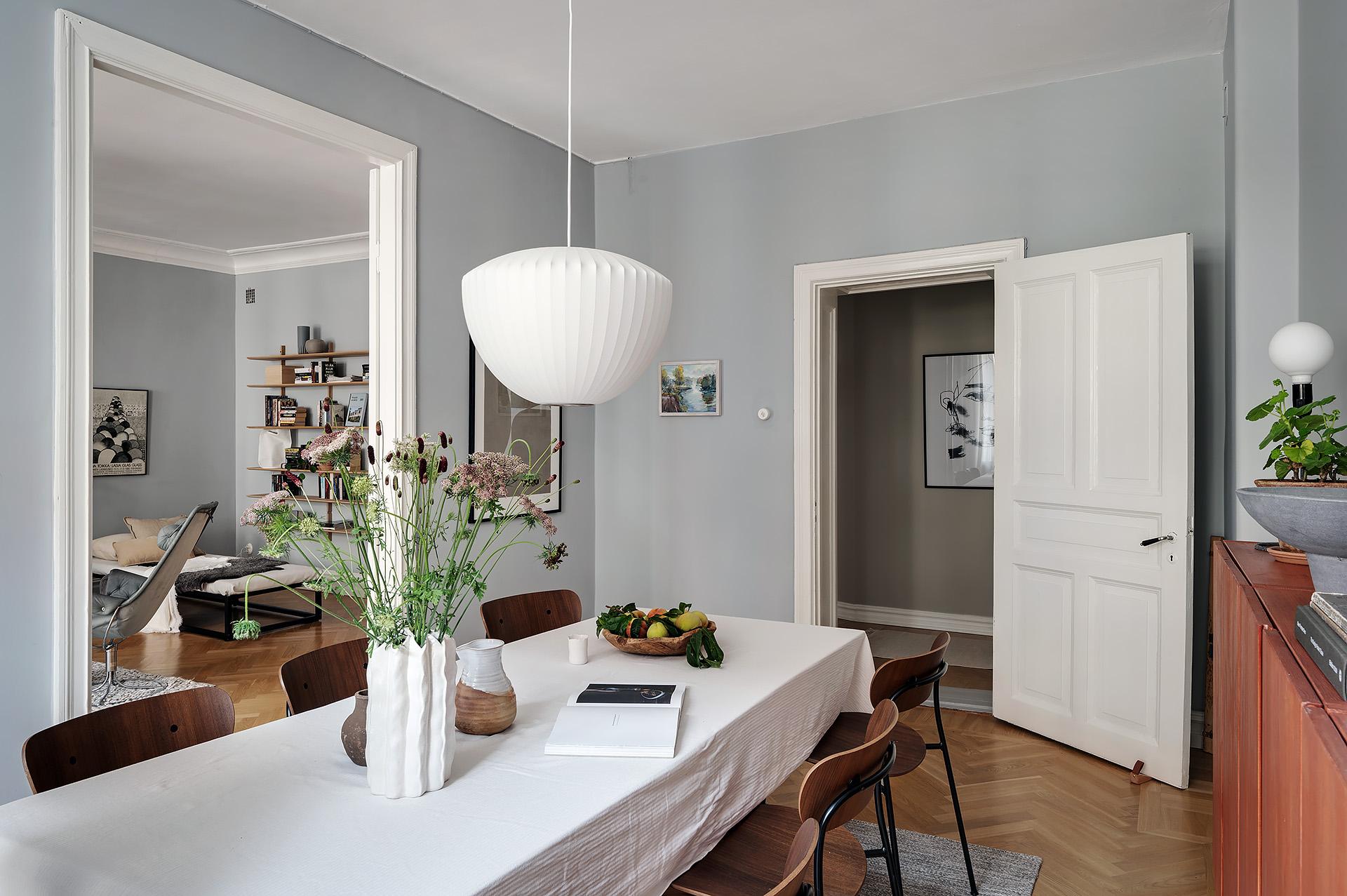 Grey kitchen cabinets against sage green walls in an attic apartment - COCO  LAPINE DESIGNCOCO LAPINE DESIGN